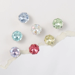 Detail view of 8mm rose-cut colorful crystals in seven vibrant jewelry-grade hues