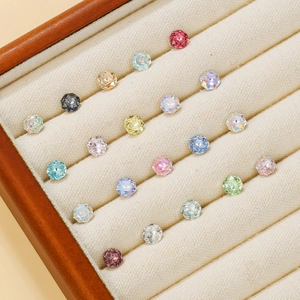 Macro shot of colorful 8mm rose-cut crystals displayed in a velvet jewelry box