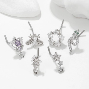 L-shaped surgical steel nose studs set with bee snake and heart animal designs