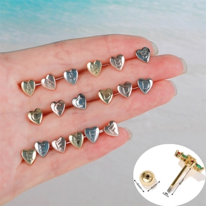 Polished heart-shaped alphabet stud earrings in gold, silver, and rose gold finishes
