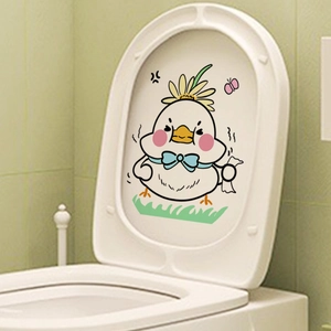 Cartoon chick toilet lid sticker with sunflower and blue bow on a green tile background