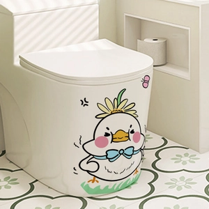 Detail of cute cartoon chick toilet sticker with daisy and blue bow on white toilet seat