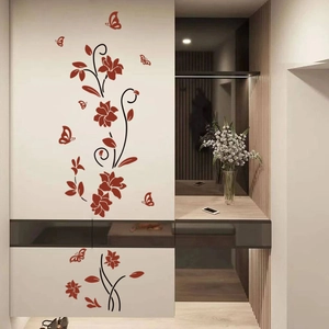 Detail view of red flower vines and butterfly wall stickers on white cabinet doors