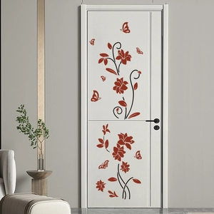 Red flower vine wall stickers with butterflies on a modern white door in a living room
