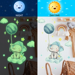 Glow-in-the-dark baby elephant and moon wall stickers showing day and night effect