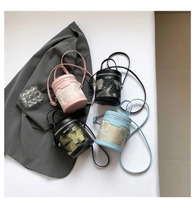 Top view of mini cylinder bucket bags featuring Chinese embroidery in four colors