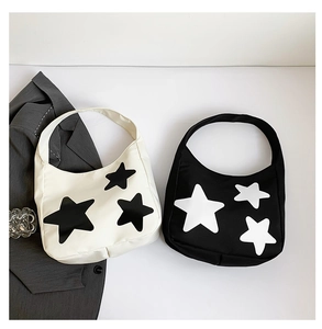 Detail of star pattern crescent hobo bags in black and white lightweight nylon fabric