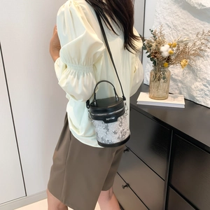 New Chinese style embroidered cylinder handbag with contrast leather and crossbody strap