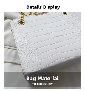 Close-up of the white crocodile texture PU leather and gold metal chain details