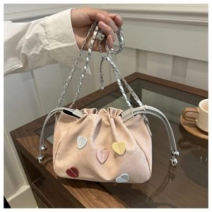 Sweet pink bucket bag with colorful heart patches and silver chain strap for women