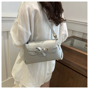 Silver-gray crossbody bag featuring a knotted buckle detail and metallic leather texture