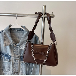 Dark brown faux leather crossbody bag with floral silver chain and twisted strap details
