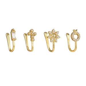 Dettaglio di quattro clip per naso non perforate dorate con fiore in zirconia e croce