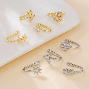 Set of 8 gold and silver non-pierced ear cuffs with star and floral zircon designs