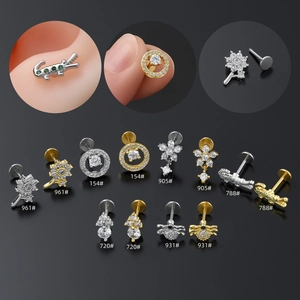 Detailed showcase of diverse flower and animal piercing studs in silver and gold tones