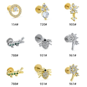 Detailed grid of stainless steel flat back studs with flower, spider, and animal designs