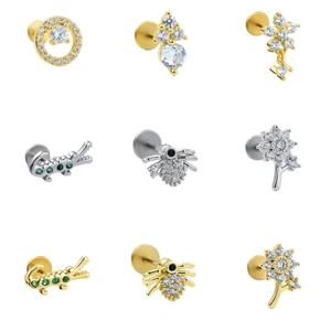 Surgical steel labret set featuring floral, spider, and crocodile designs with green zircons