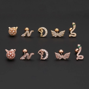 Angel wing and moon piercing earring set in gold and rose gold with zircon inlay