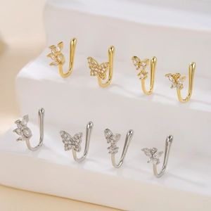 Detailed set of butterfly and leaf fake nose rings with sparkling zircons on stone pedestals