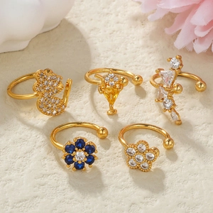 Detail shot of five-piece gold ear cuff set with colorful zircon and floral cat motifs