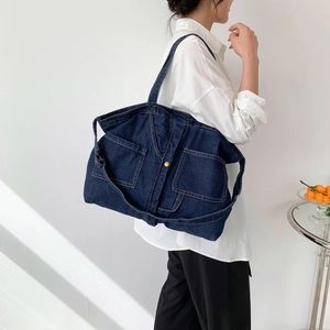 Vintage navy denim large tote bag with big front pockets and bronze metal snap button