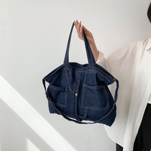 Large capacity navy blue denim tote bag with dual front pockets and shoulder strap