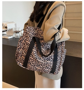 Leopard print canvas tote bag featuring large capacity and black wide shoulder straps