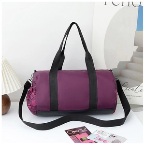 Detail of purple nylon travel bag showing camo side pocket and sturdy black straps