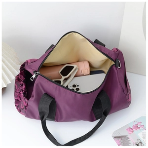 Interior view of large purple nylon travel bag showing spacious capacity and camouflage print