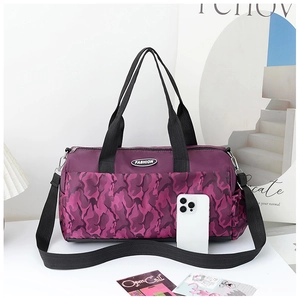 Close-up of purple camo nylon travel bag with Fashion logo and adjustable straps