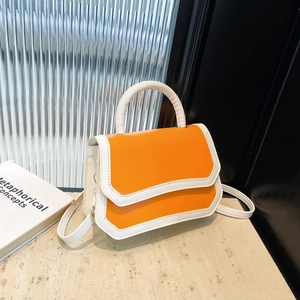 Modern orange and white contrast square crossbody bag with textured leather and top handle