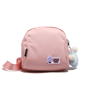 Pink nylon crescent crossbody bag with fashion label and plush charm for women