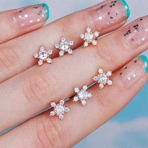 Sparkling snowflake stud earrings with zircon in gold, silver, and rose gold finishes
