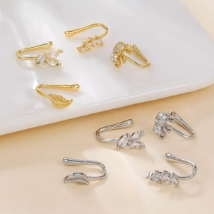 U-shaped copper nose clips with zircons featuring leaf and elephant designs in gold and silver