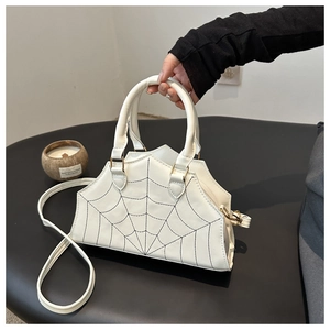 Chic white spider web shoulder bag with black embroidery and gold metal hardware
