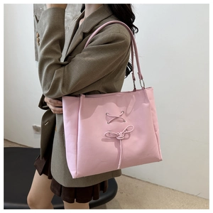 Pink ballet-style bow tote bag with twisted shoulder straps and large capacity for women