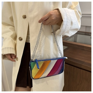 Chic rainbow striped leather crossbody bag with silver rivet details and chain strap