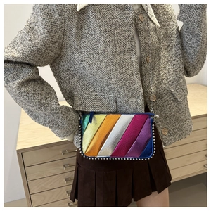 Rainbow striped crossbody bag with silver rivet trim and metal chain strap for women