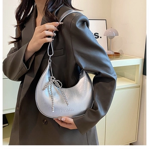 Silver metallic hobo shoulder bag for women with fashion embossing and bow charm