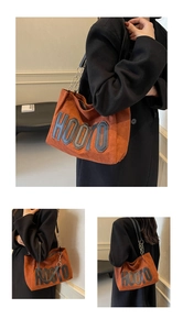 Close-up of terracotta suede tote bag with HOOTO patch and metal chain strap detail