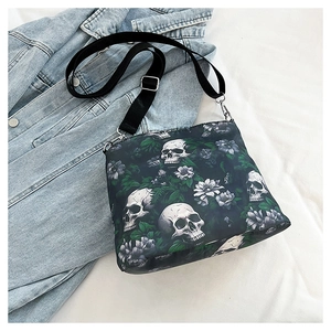 Detail shot of gothic skull and floral jacquard pattern on a trendy shoulder bucket bag