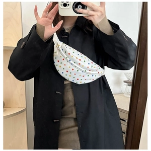 Minimalist white polka dot canvas waist bag with colorful prints and adjustable strap