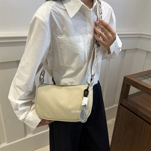 Fashionable cream nylon crossbody bag with geometric embroidery strap and OOTMA logo