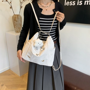 White versatile tote bag with metal butterfly and plush cloud charm in Korean style