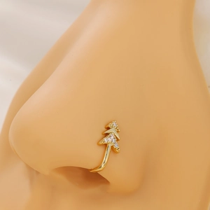 Gold Christmas tree nose ring with zircon stones on a model in a close-up view