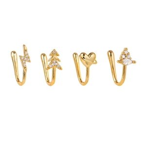 Macro shot of 18k gold plated non-piercing nose clips with heart and lightning zircon charms