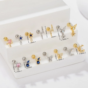 Detailed collection of crystal-studded star and heart earrings on a white display