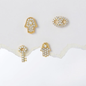 Luxurious gold Hamsa Hand and key stud earrings with sparkling cubic zirconia pavé
