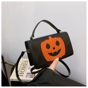 Black PU leather mini crossbody bag featuring an orange Halloween pumpkin patch