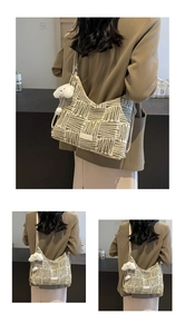 Detail of woven tote bag with geometric stripes and a white cloud plush charm accessory